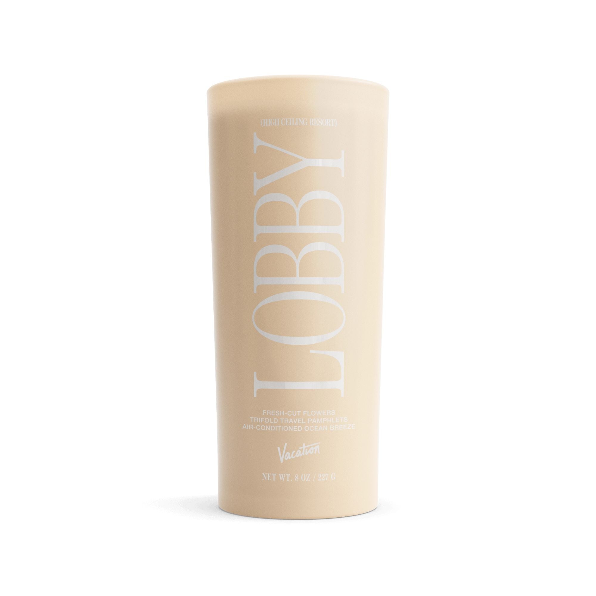 Beige 'LOBBY' candle on a white background