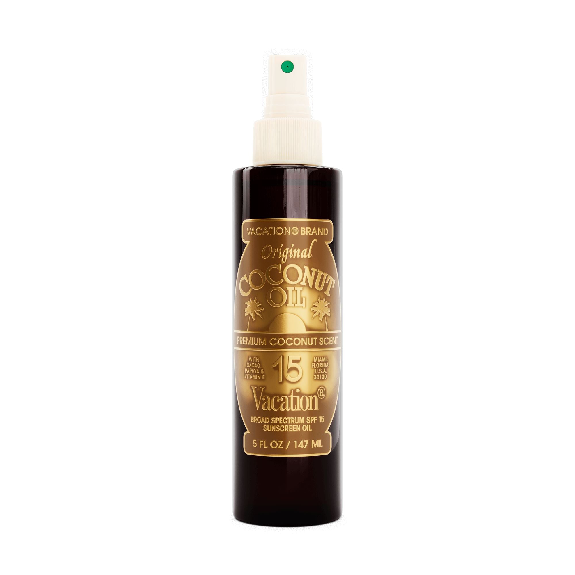 Vacation brand coconut oil spray bottle on a white background