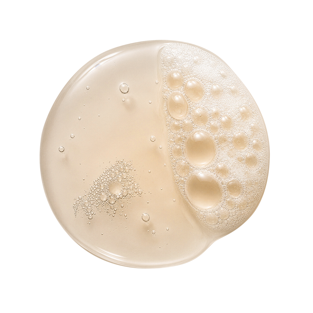 Small pool of Glycolic Body Wash - Fig & Amber poured out on a white background