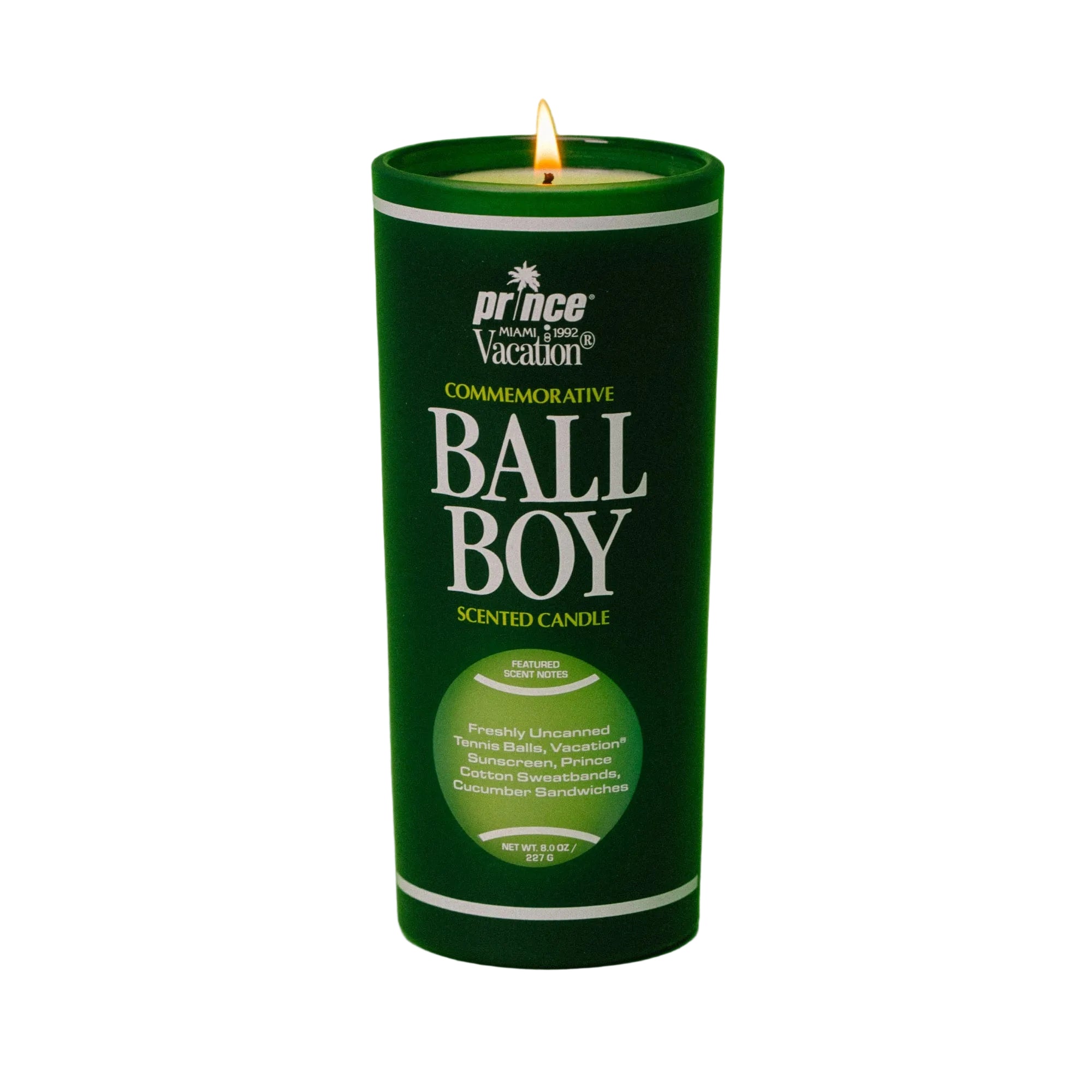 Green candle in a cylindrical container with 'Ball Boy' branding on a green background