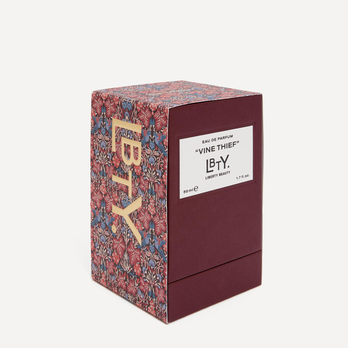 Perfume box with floral design and visible branding on a white background