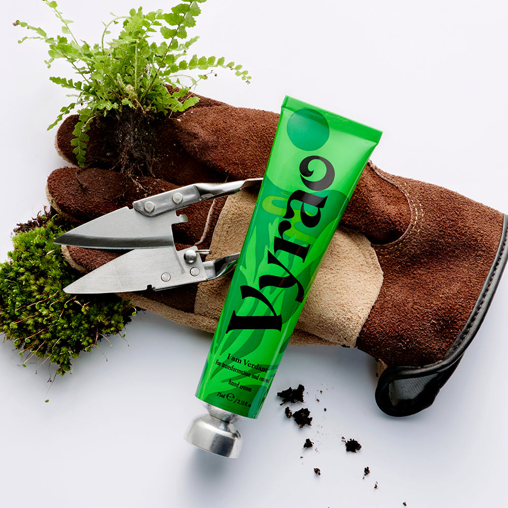 Green tube labeled 'Vyroa' with gardening tools and plants on a white background