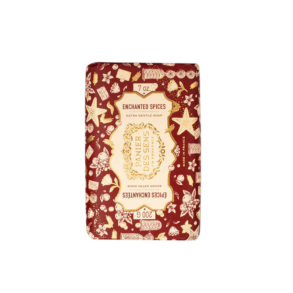 Bar of soap with decorative packaging featuring starfish and text on a white background