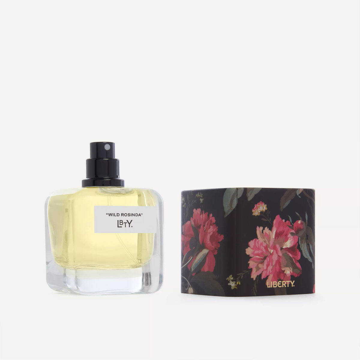 Perfume bottle with floral design packaging on a white background