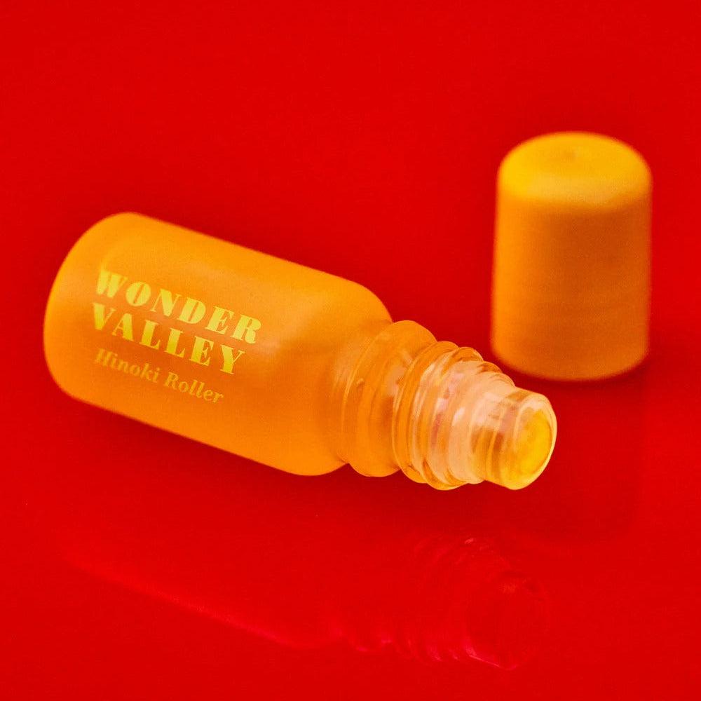 Yellow bottle with cap on a red background