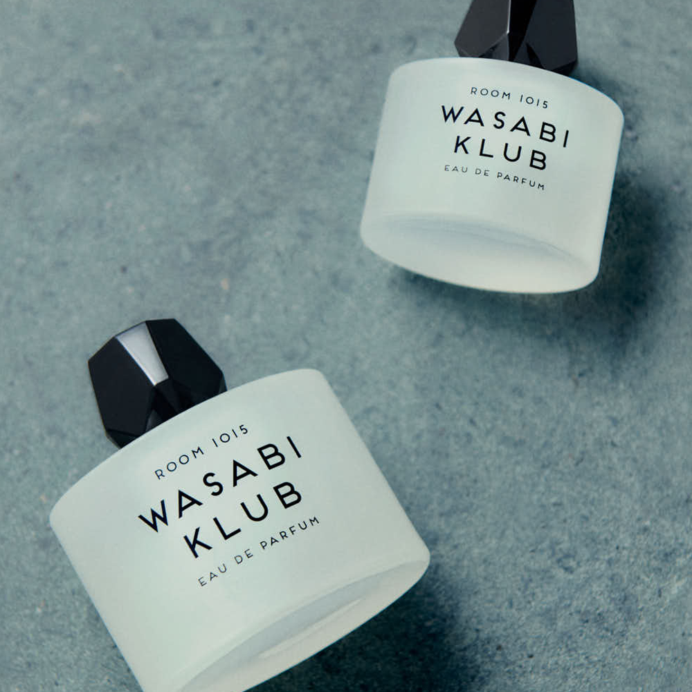 Room 1015 Wasabi Klub Eau De Parfum bottles on a textured, neutral background