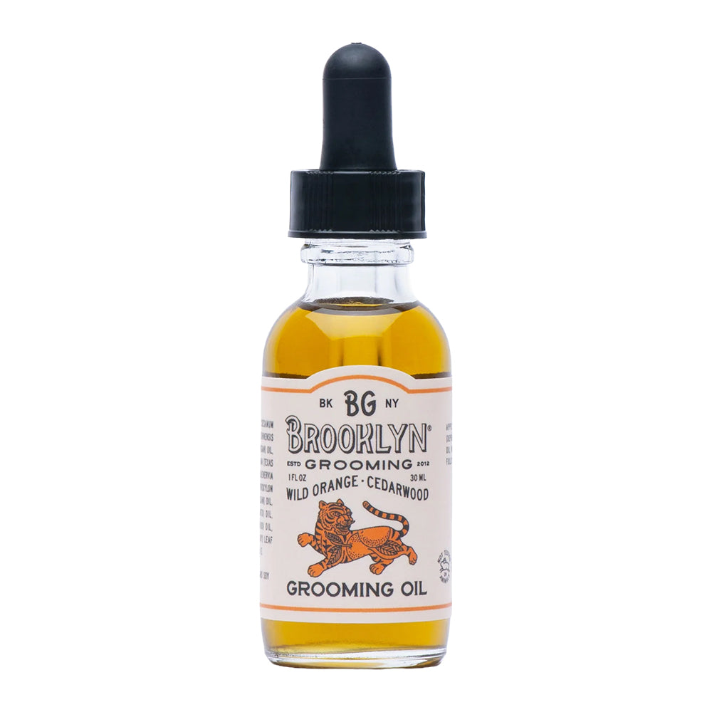 Bottle of Brooklyn Grooming oil with a tiger logo on a white background