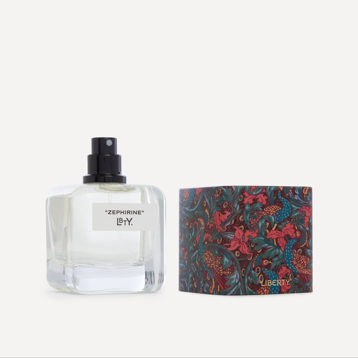 Perfume bottle with floral packaging on a white background