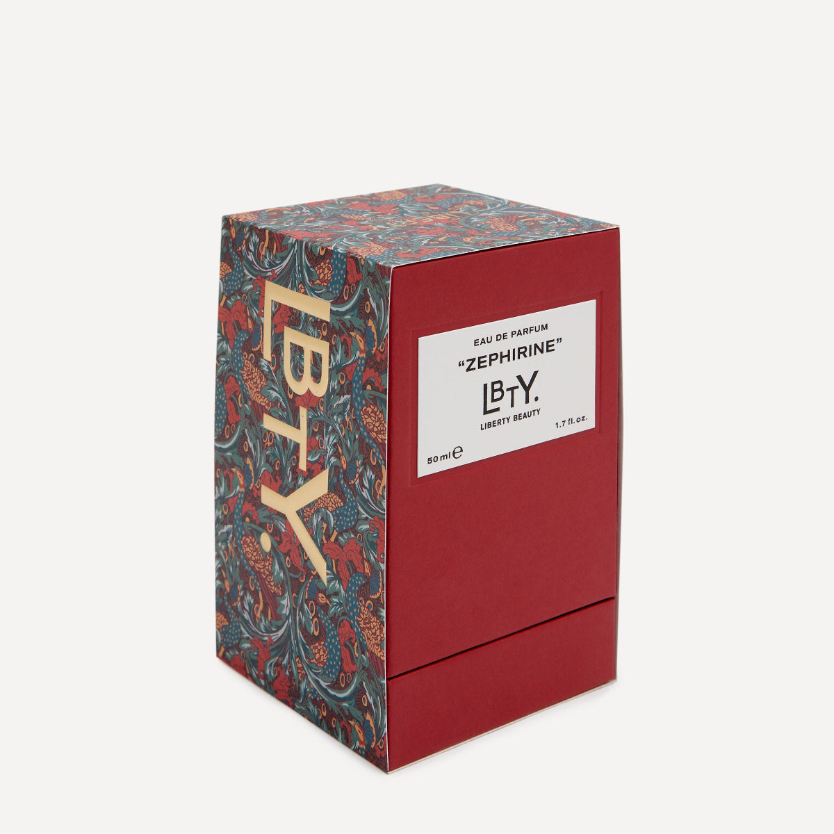 Red and patterned LBTY perfume box on a white background