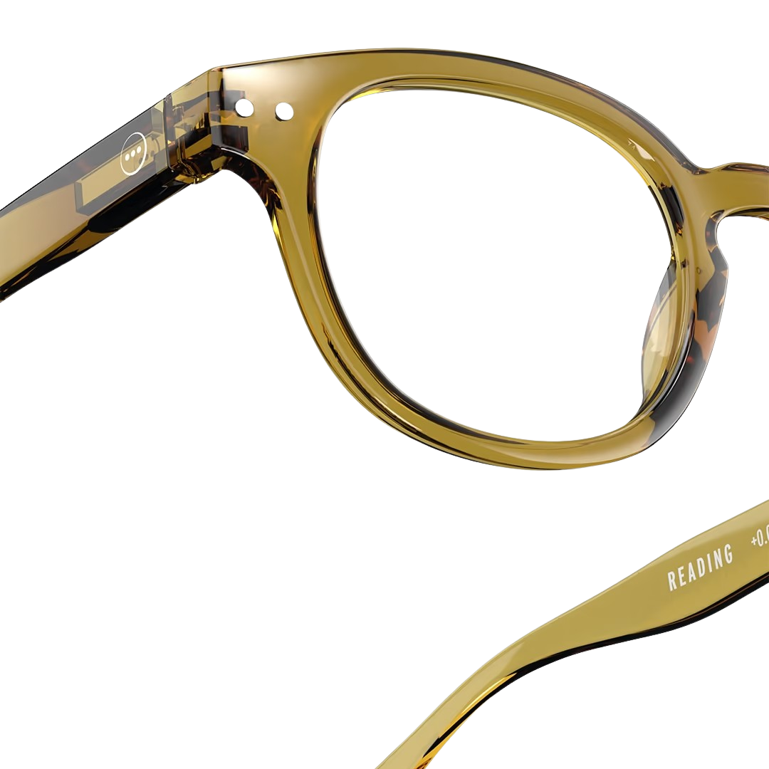 Pair of eyeglasses with a golden green frame on a white background