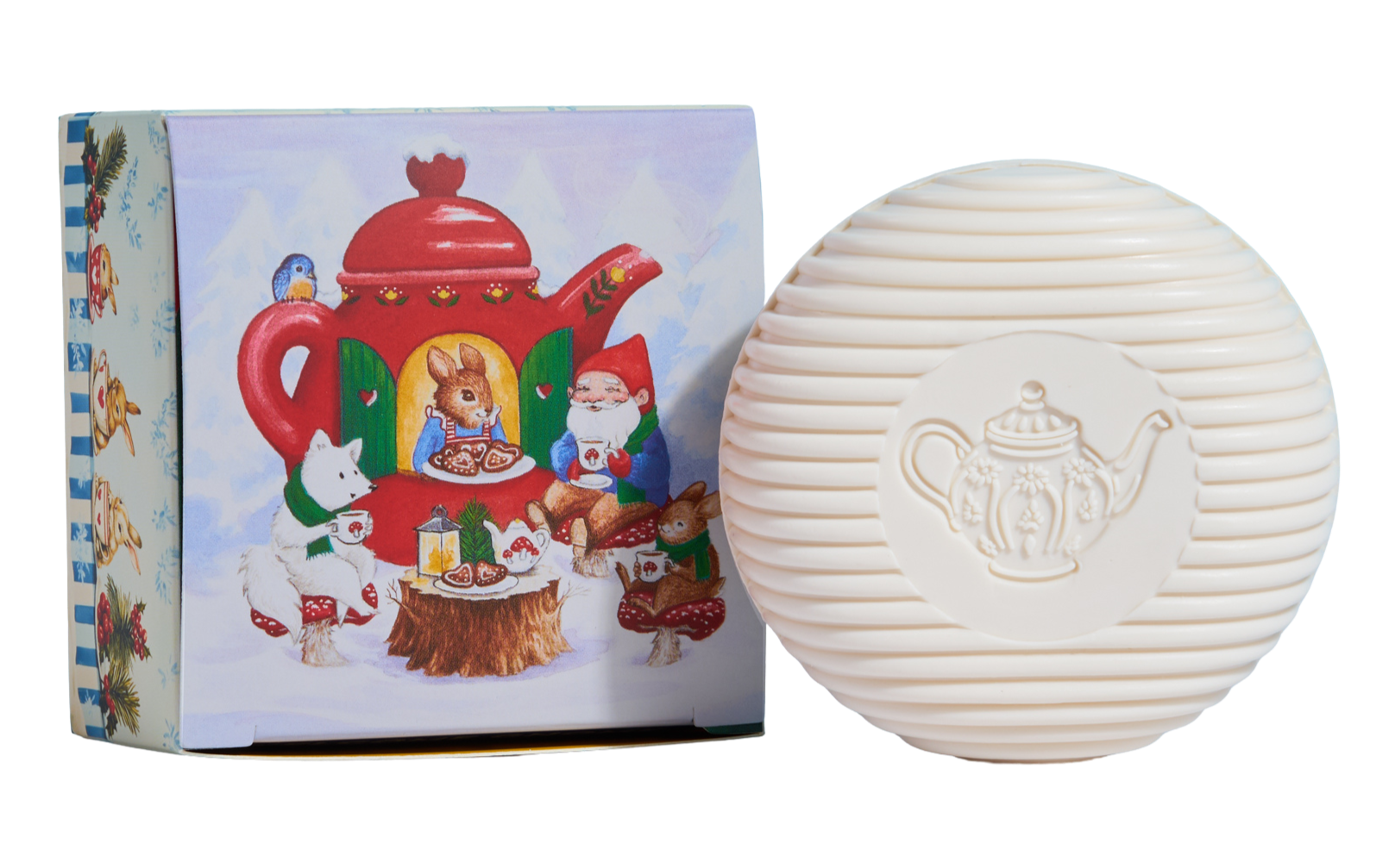 White soap bar with Tea pot embossed design next to a colorful box featuring a teapot illustration
