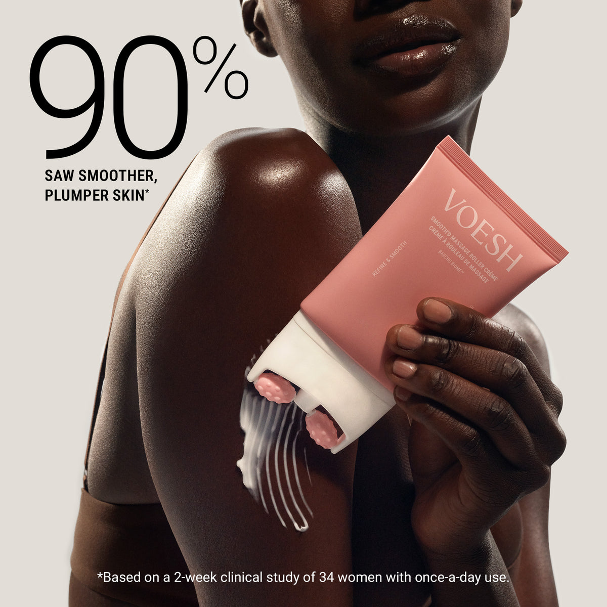 Person holding a pink skincare product with visible texture, labeled 'VOESH', against a neutral background.