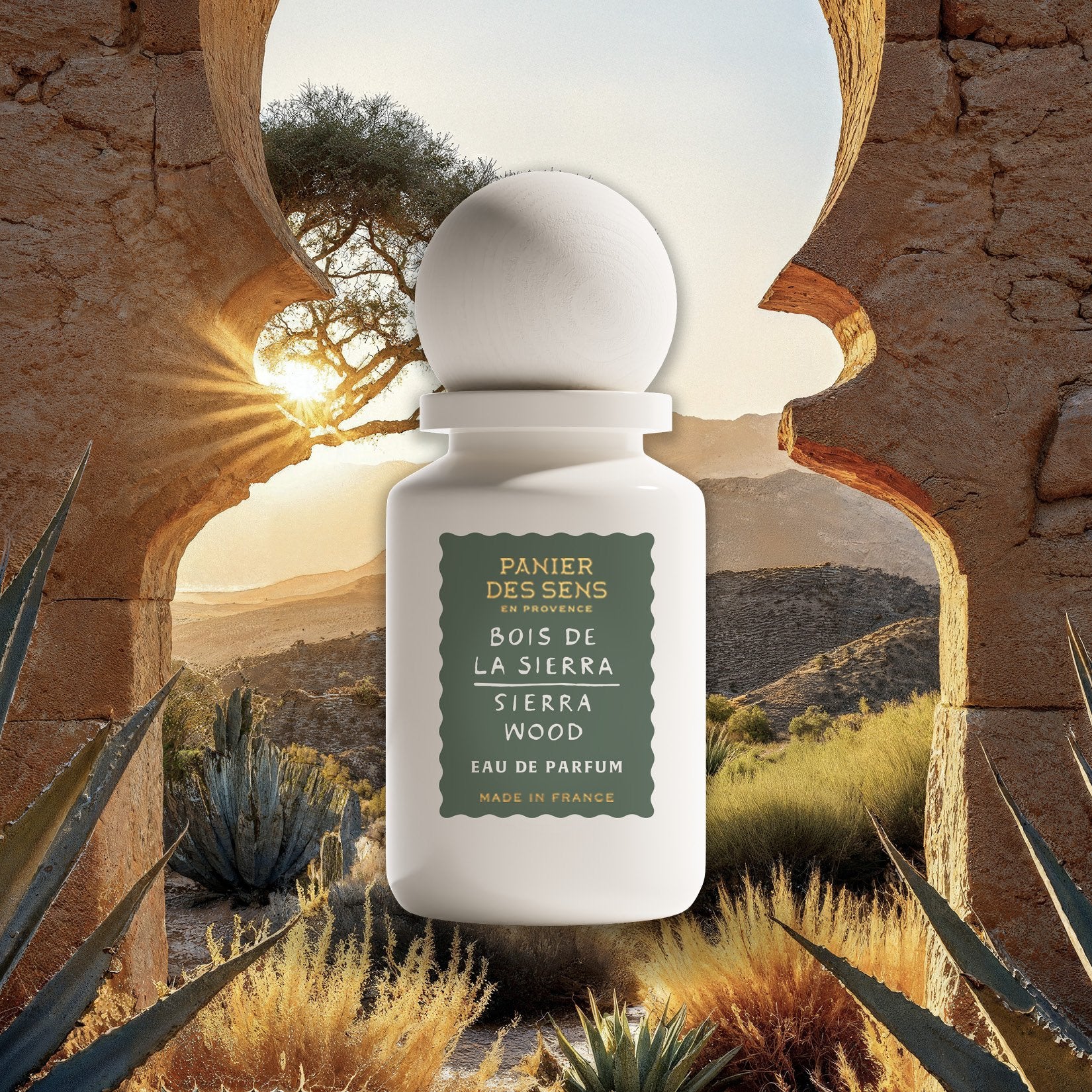 Perfume bottle labeled 'Bois de la Sierra' with a desert landscape in the background