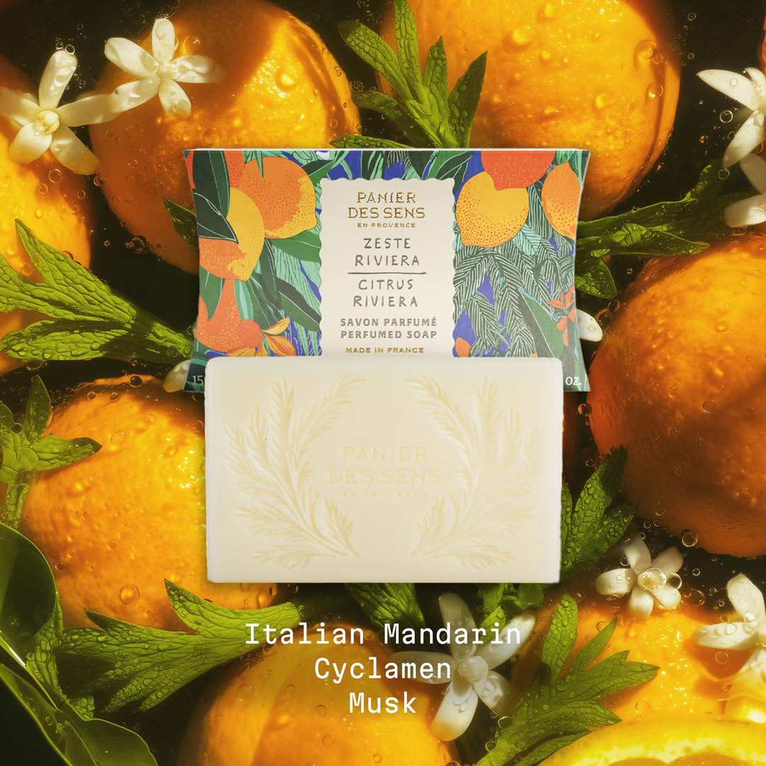Citrus Riviera Bar of soap with packaging surrounded by oranges and mint leaves