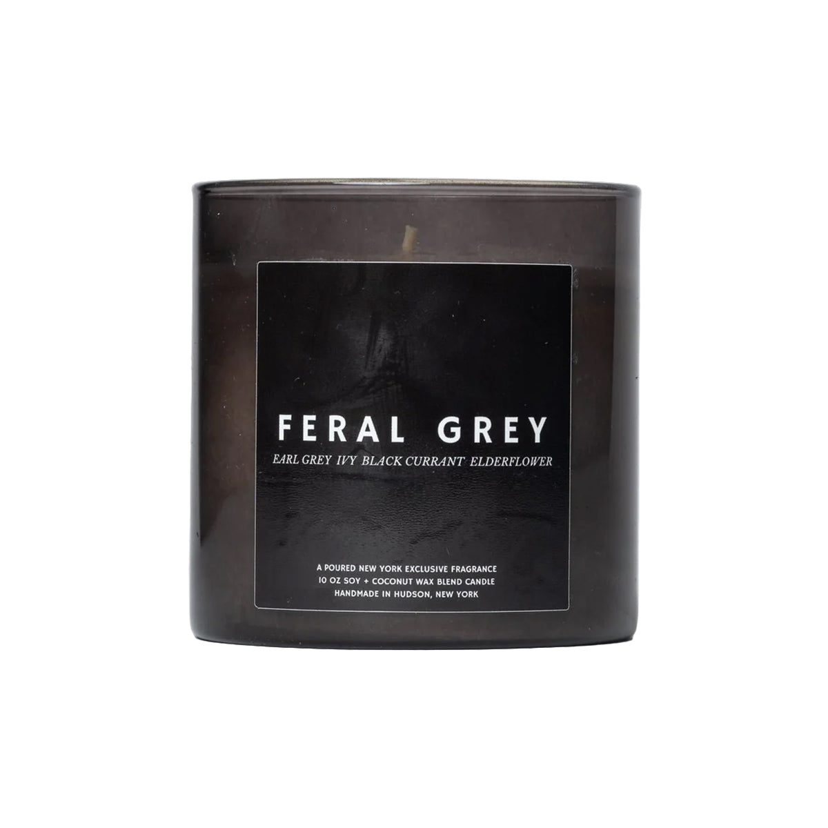Black candle with 'Feral Grey' branding on a white background