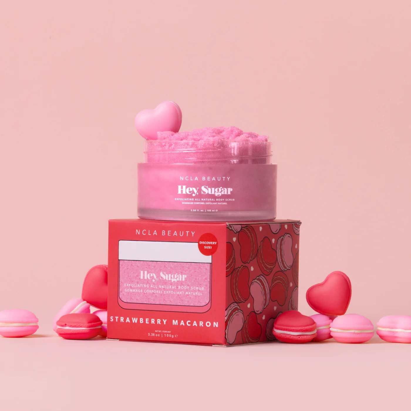 NCLA Beauty Hey Sugar Strawberry Macaron product with packaging on a pink background