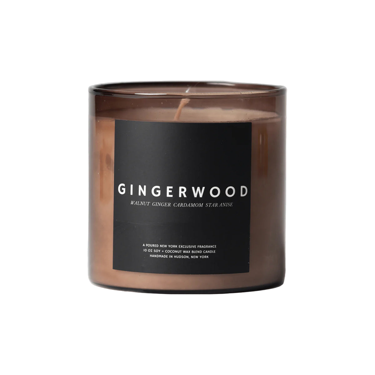 Gingerwood candle in a clear container on a white background
