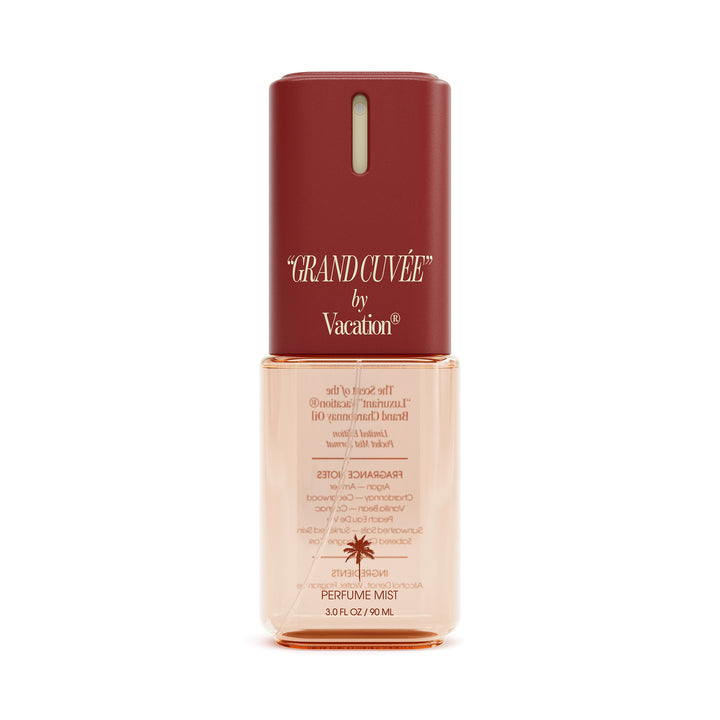Perfume mist bottle with red cap and beige body on a white background