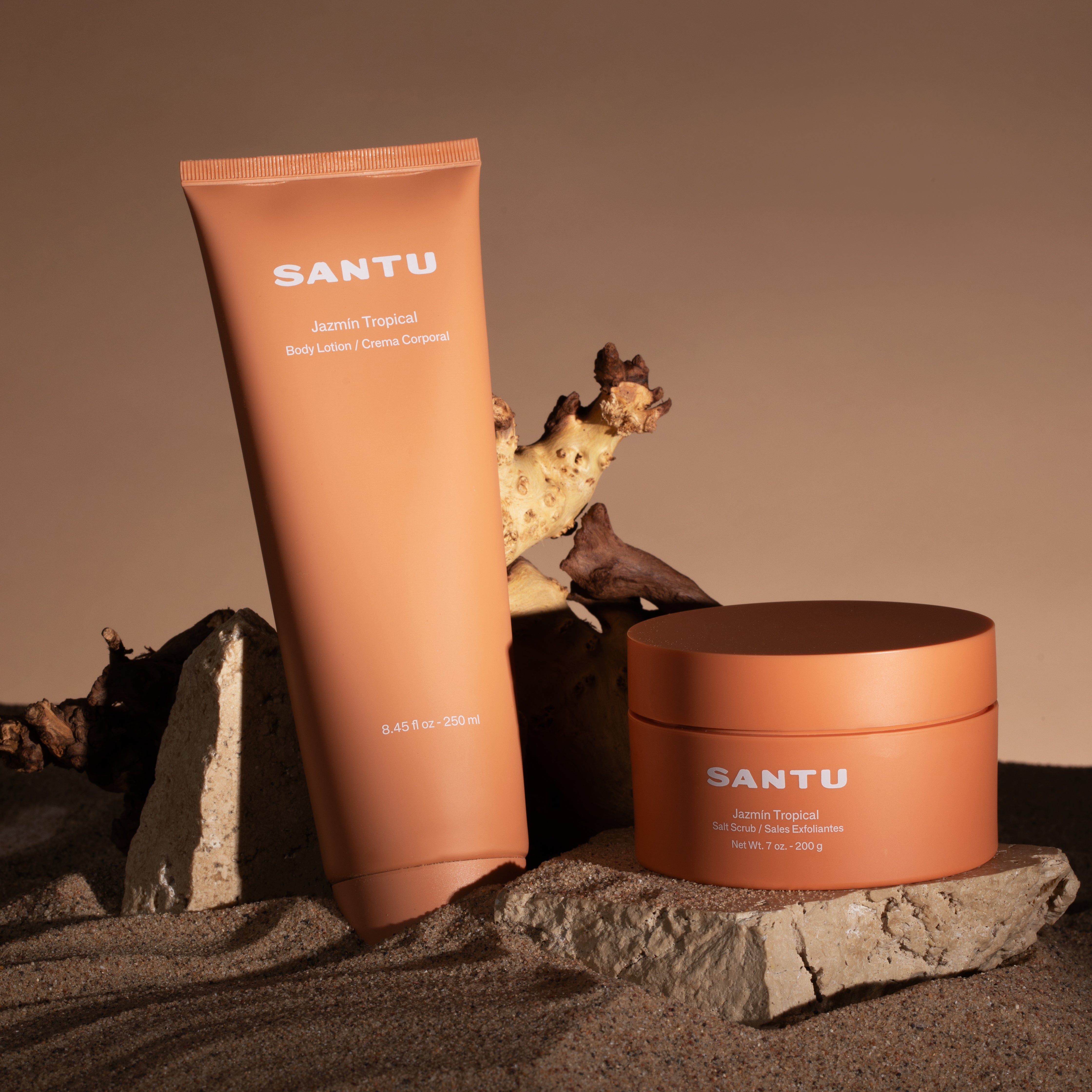 SANTU body lotion and salt scrub on a stone surface with a natural background