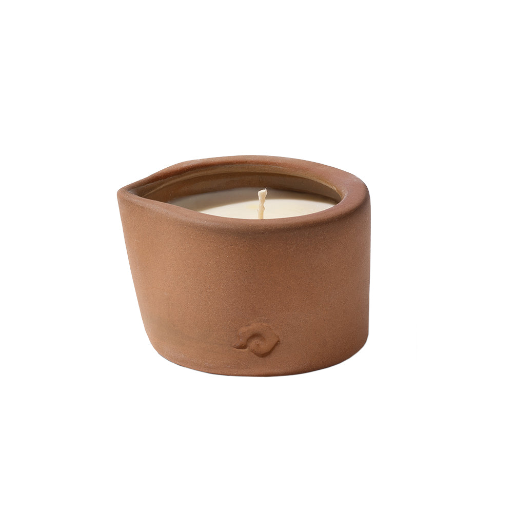 Ceramic candle on a white background