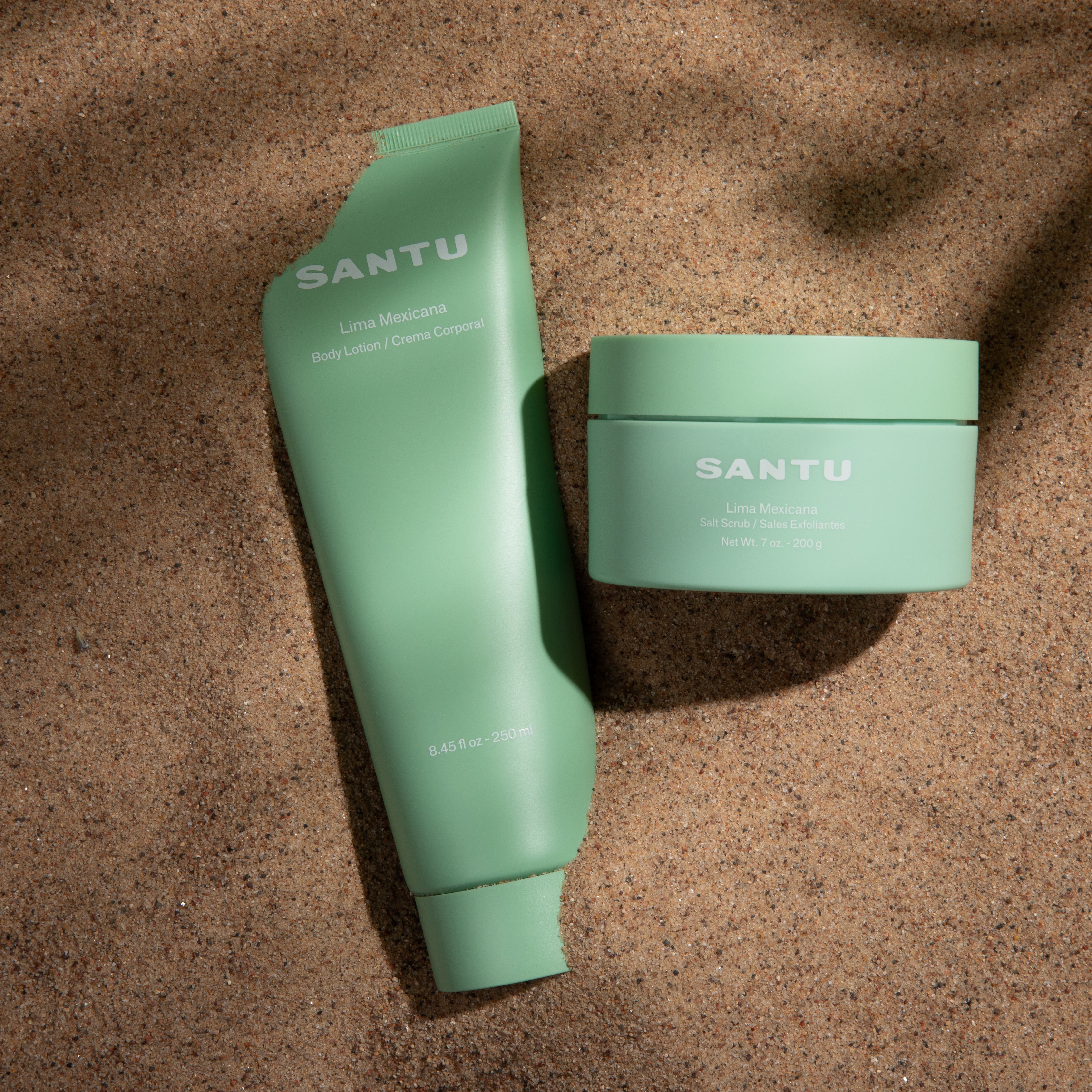 Two green skincare products with 'SANTU' branding on a brown textured background