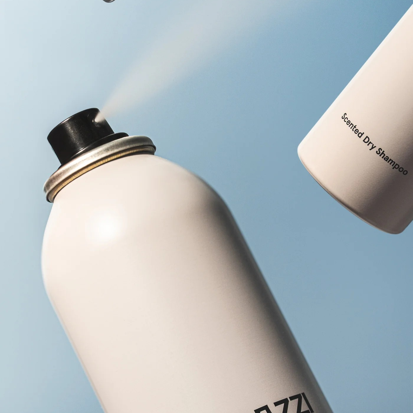 Fugazzi Scented Dry Shampoo close up of the canister spraying.