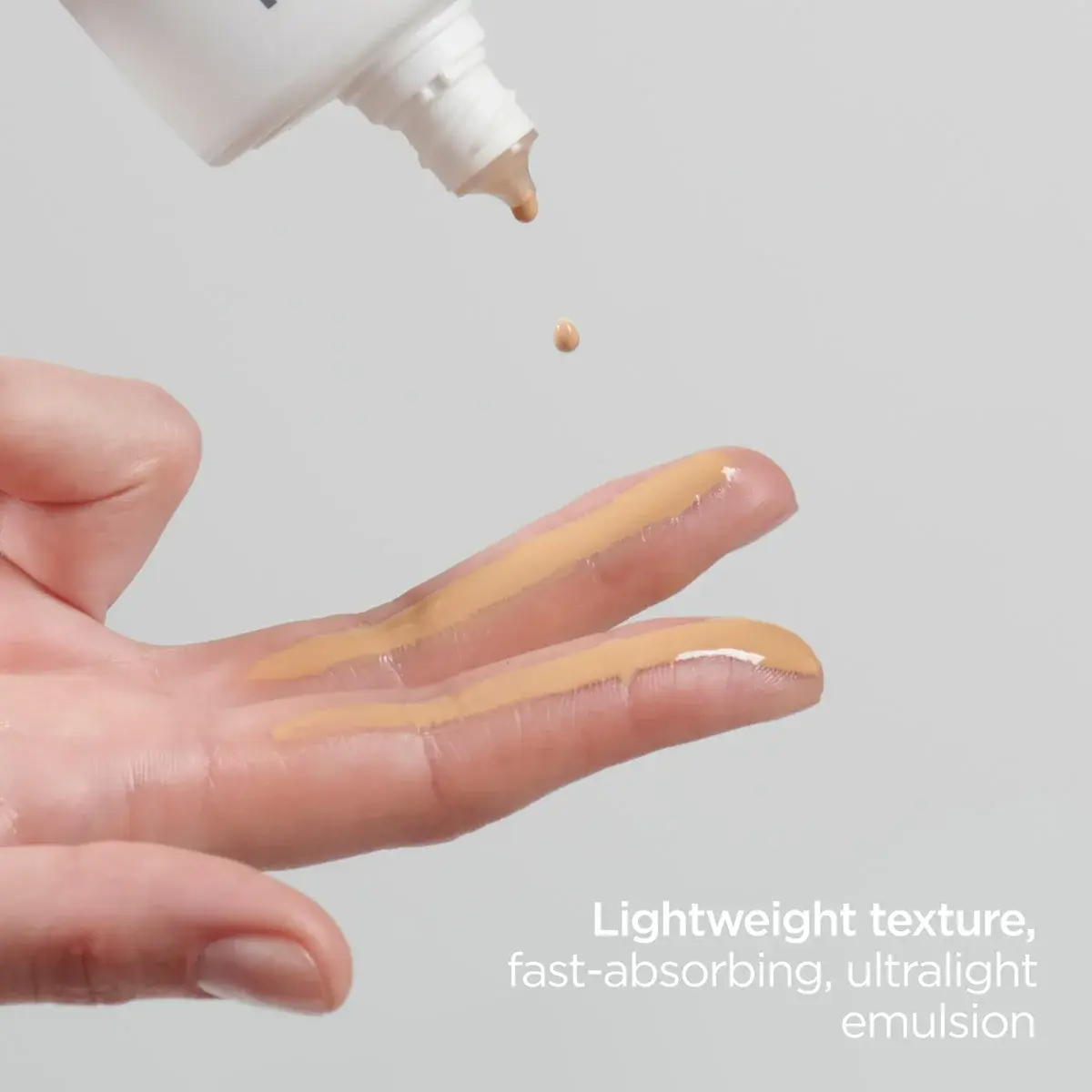 Hand applying ISDIN product with text describing its properties.