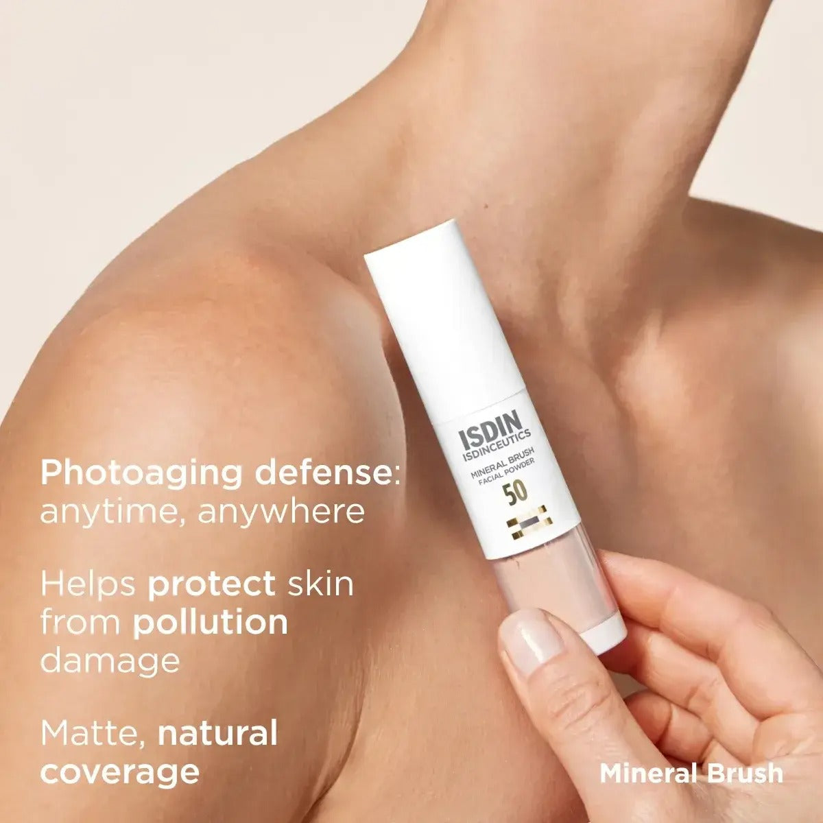 Person holding ISDIN ISDINCEUTICS Mineral Brush in container against their body