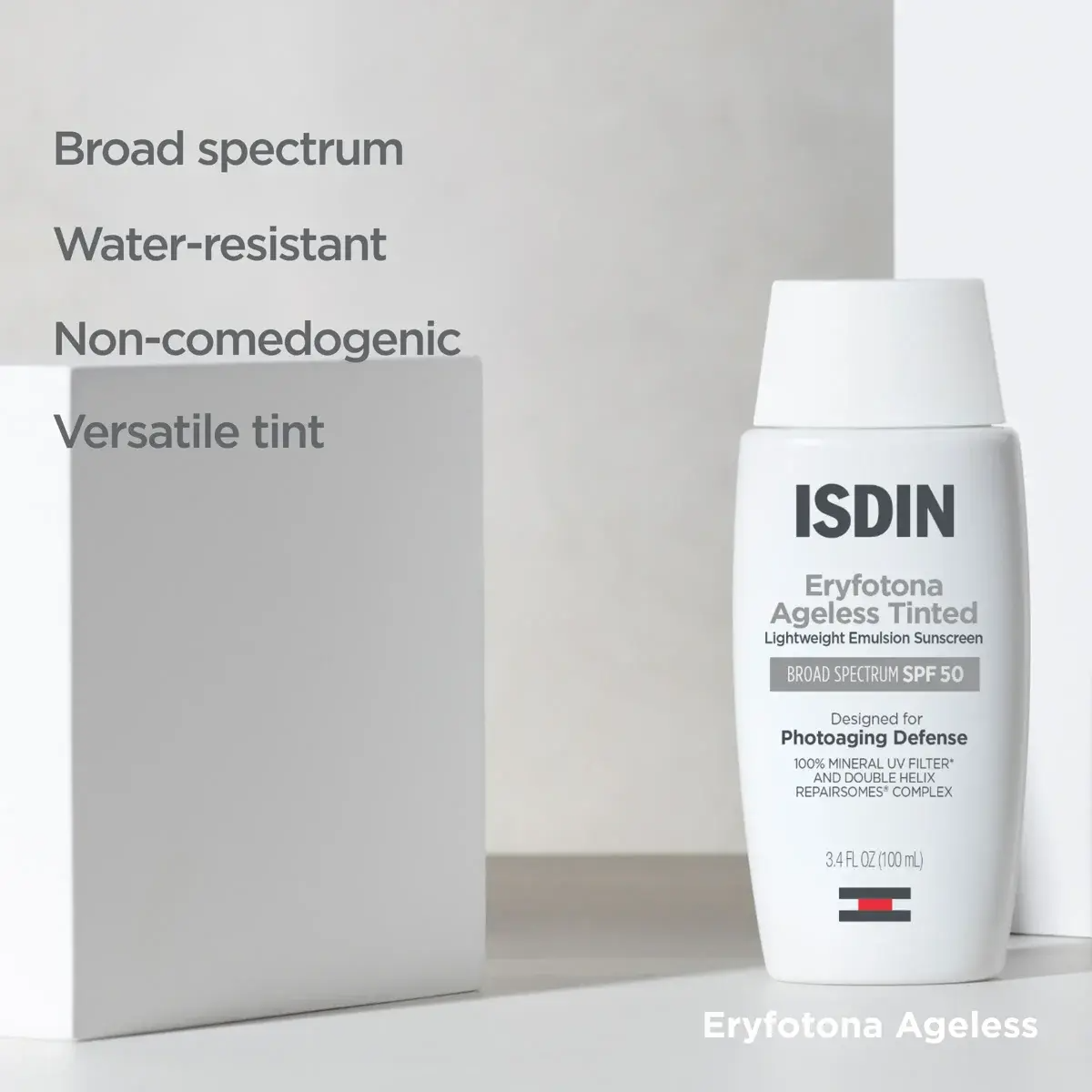 ISDIN Eryfotona Ageless Tinted Sunscreen SPF 50 bottle shown next to its white packaging box on a light gray background, with text listing product features on the left.