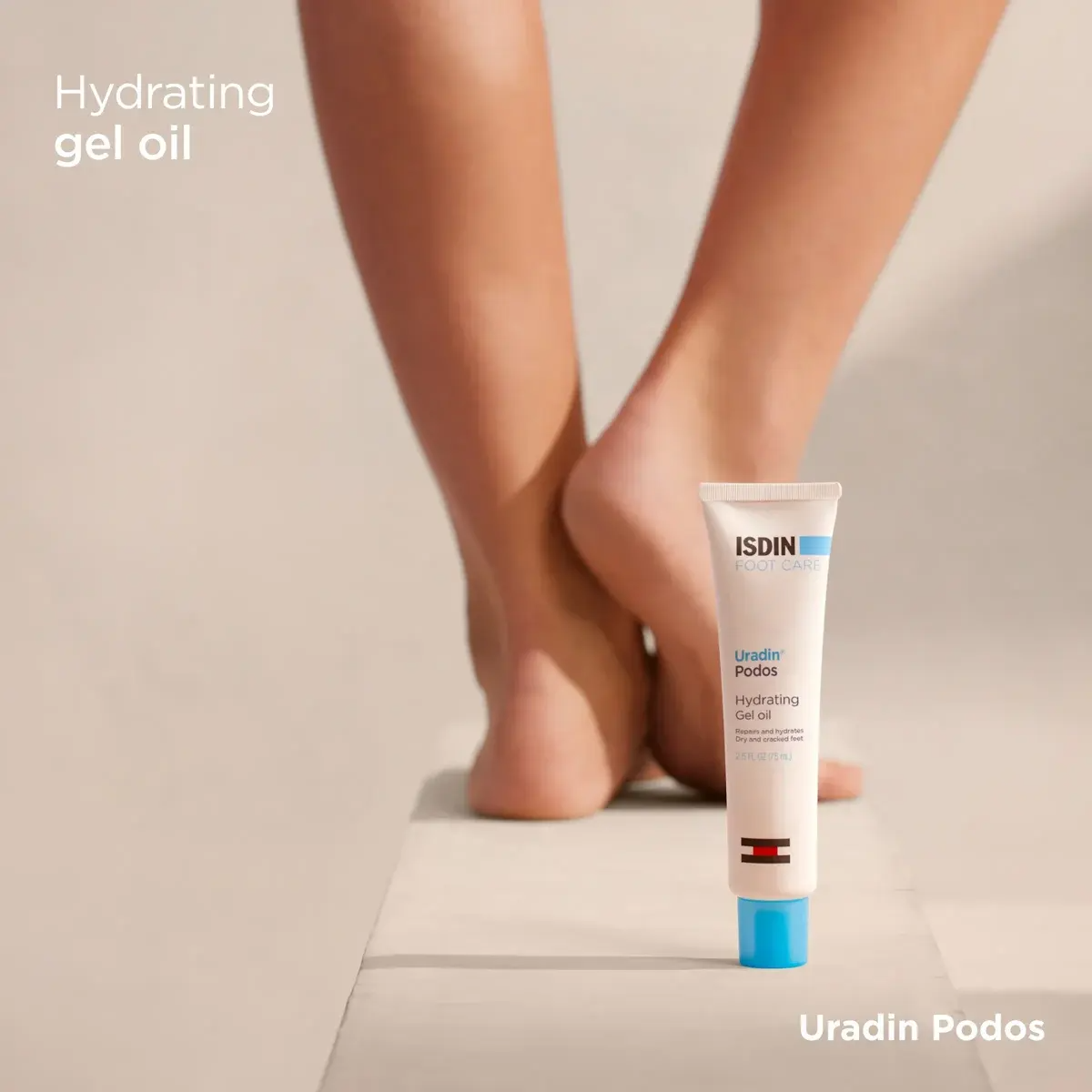 Isdin Ureadin Podos hydrating gel oil tube with a foot in the background