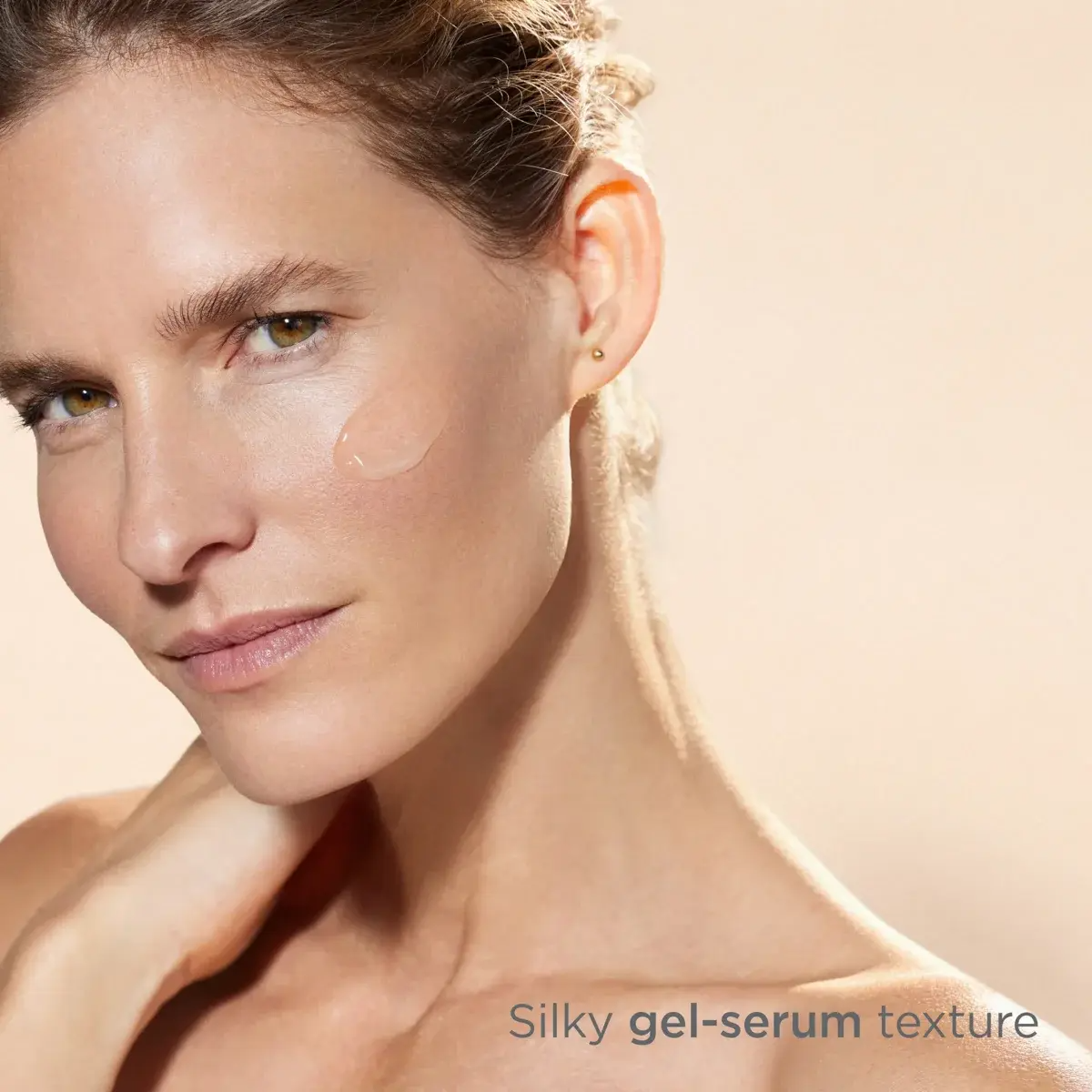 Woman with ISDIN ISDINCEUTICS Melaclear Advanced 3% applied to her face
