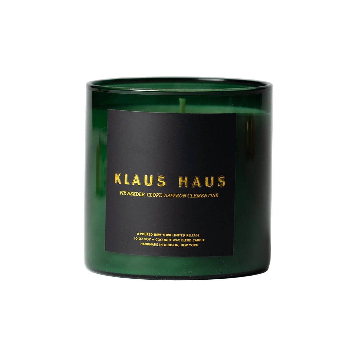 Green candle with a black label featuring 'Klaus Haus' on a white background