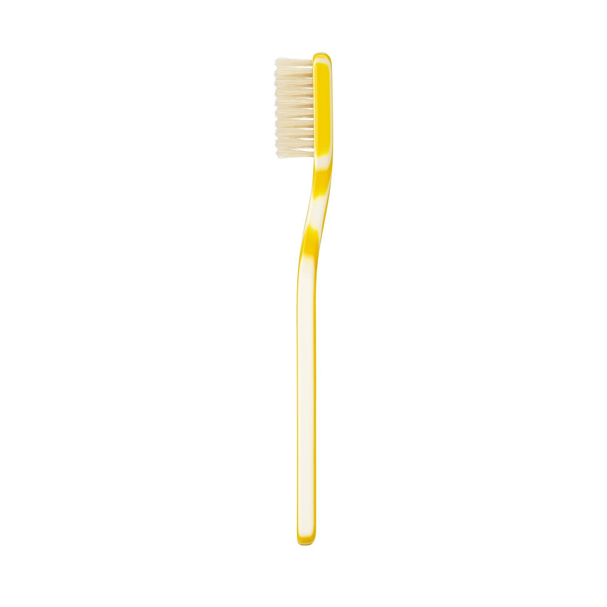 A single yellow toothbrush with cream-colored bristles, shown vertically against a plain white background.