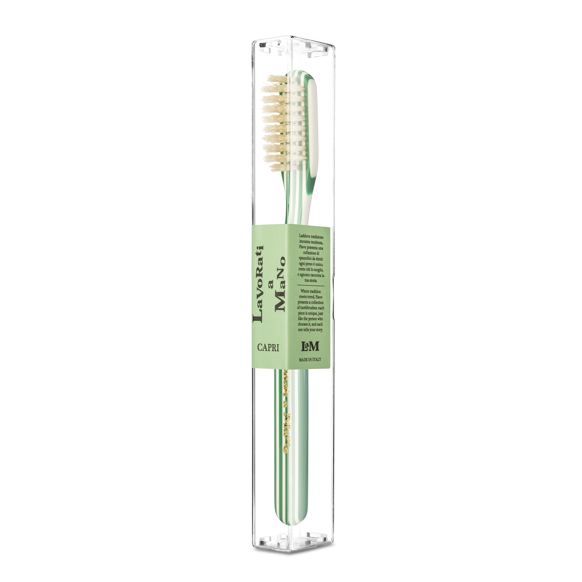 Green Capri Collection Toothbrush in a clear plastic case with a light green paper band label. The toothbrush has a pale green handle, natural beige bristles, and a matching light green bristle edge.