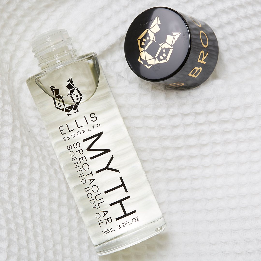Ellis Brooklyn Myth hair product bottle and cap on a textured white background