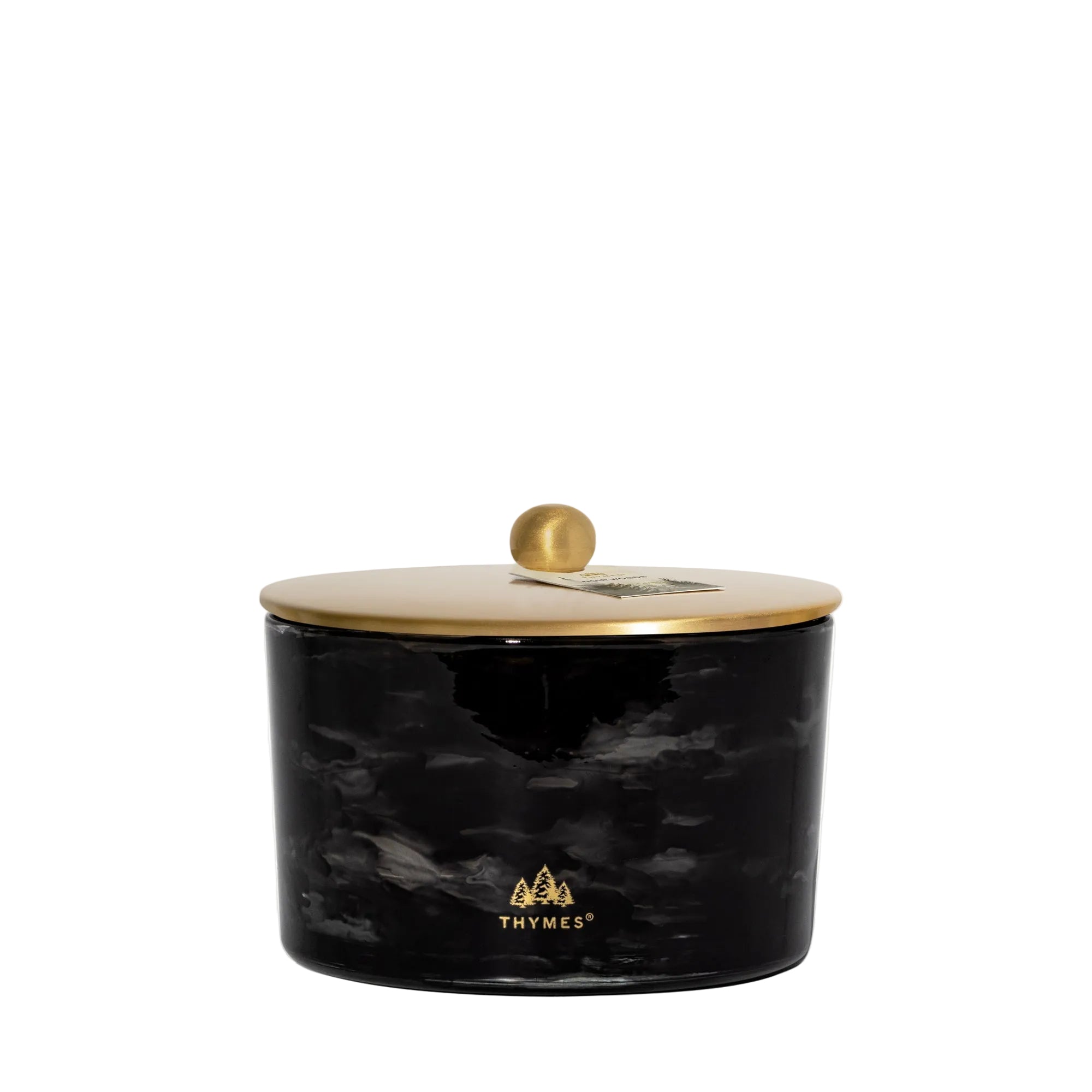 Black marbled candle jar with a gold lid on a white background, featuring the Thymes logo.