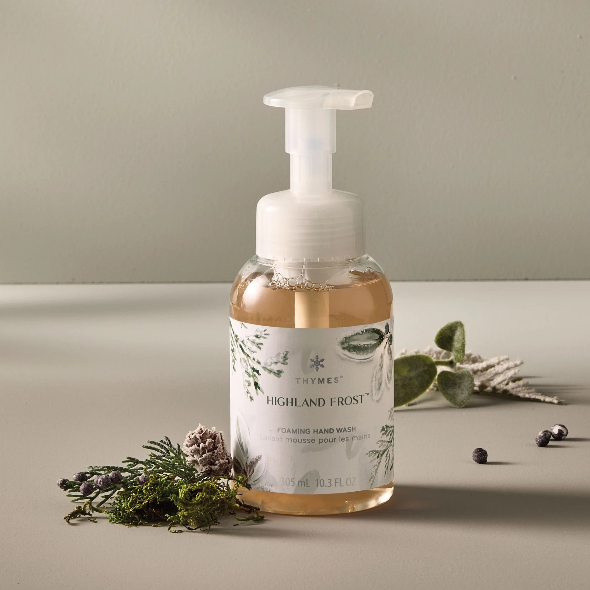 Foaming hand wash bottle labeled 'Highland Frost' with natural elements on a neutral background