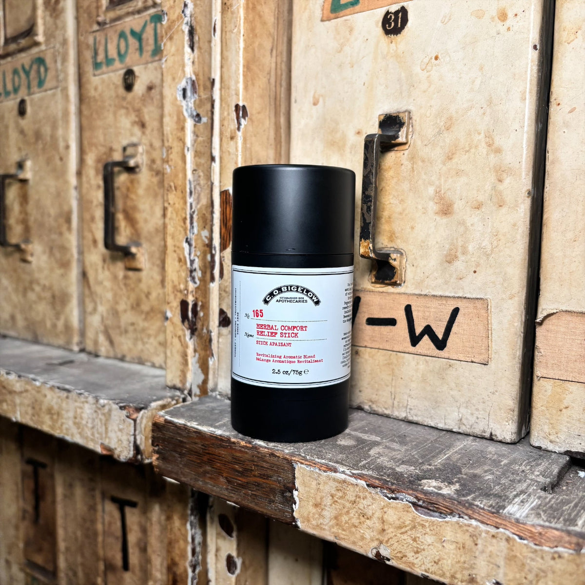 Herbal Comfort Relief Stick on a wooden shelf