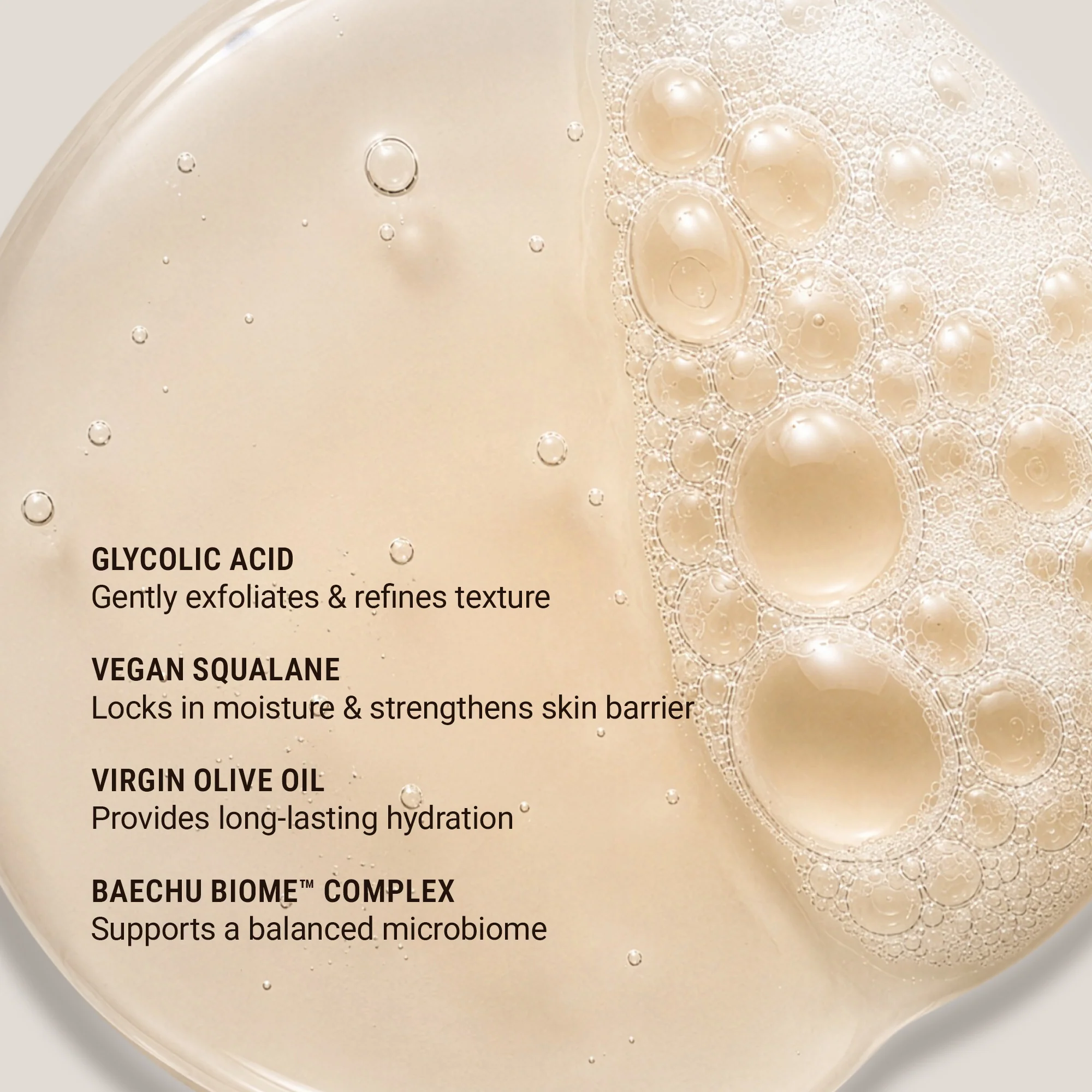Skincare product with bubbles and text detailing ingredients on a light background